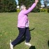 Margaret Slowgrove demonstrates throw of Vigoro ball, Booralee Park, Botany